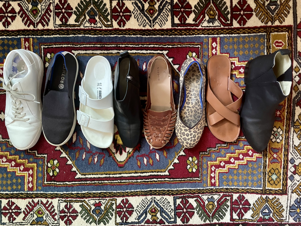 shoes in a row on a rug